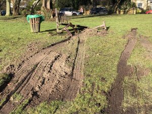 Image showing wheel tracks leading to a destroyed bench